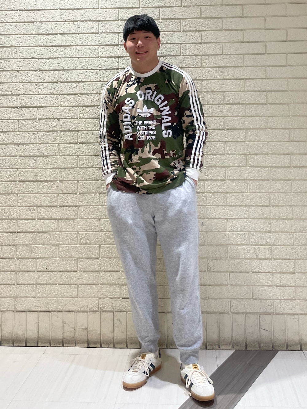 adidas（アディダス）の「カモ柄 長袖 カリTシャツ / ロンT