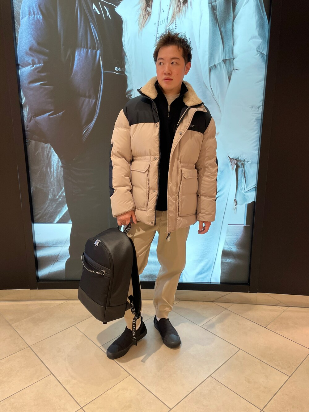 「AXchanger、armaniexchange、ARMANIEXCHANGE、カジュアルコーデ、おしゃれさんと繋がりたい、スニーカー、シンプルスタイル、冬コーデ、アウター、ベージュ、ゆるコーデ、秋のコーデ、大人コーデ、AXchange、アルマーニエクスチェンジ」｜「ARMANI EXCHANGEの【A|X アルマーニ エクスチェンジ】ハイネック　ダウンジャケット（ダウンジャケット/コート、ベージュ系）」を使った、E.YASUさん（メンズ・175cm）の秋コーディネートの1枚目の写真
