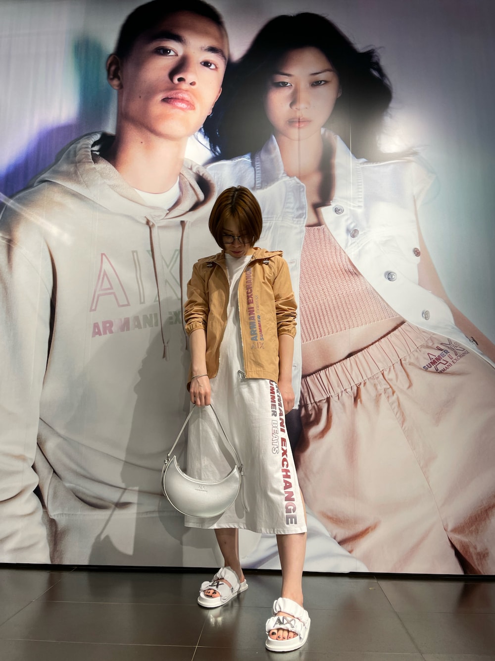 「春夏コーデ、カジュアルコーデ、夏コーデ、楽チンコーデ、夏フェス、サンダル、AXchanger、armaniexchange」｜「ARMANI EXCHANGEの【A|X アルマーニ エクスチェンジ】SUMMER BEATS　ナイロンジャケット（ナイロンジャケット、ベージュ系）」を使った、K.MOEさん（レディース・155cm）の春コーディネートの1枚目の写真