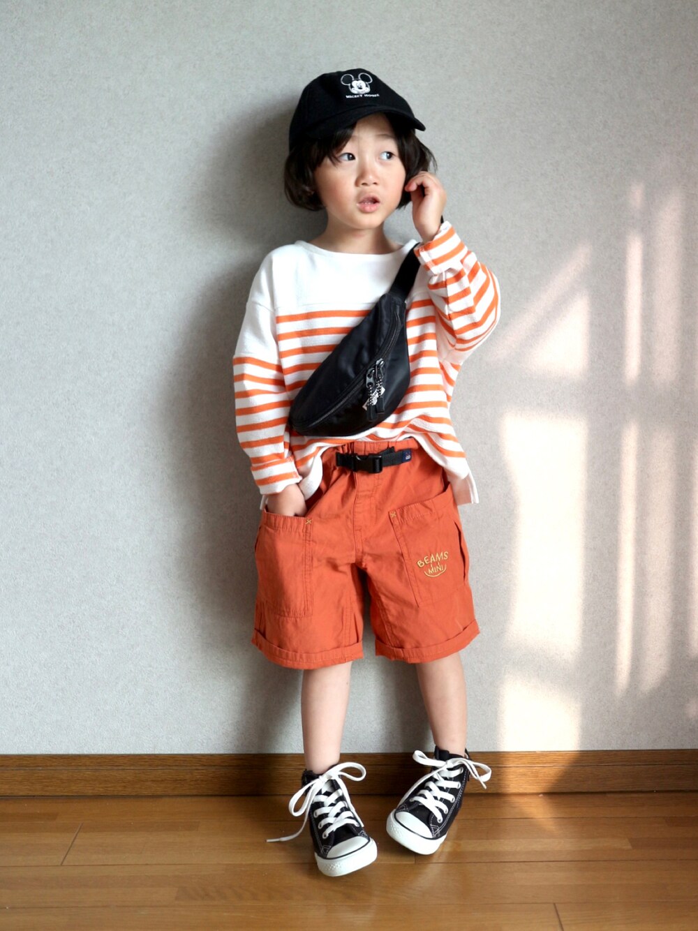 「お出かけコーデ日記、キャップ、オレンジ、ロンT、ボーダー、ショートパンツ、ハーフパンツ、春夏コーデ、初夏コーデ、コンバース、スニーカー、休日コーデ、ポシェット、PR」｜「BRANSHESのボーダー長袖Ｔシャツ_ロンT（Tシャツ/カットソー、オレンジ系）」を使った、Su,Um,Riさん（キッズ・100cm）の春コーディネートの1枚目の写真