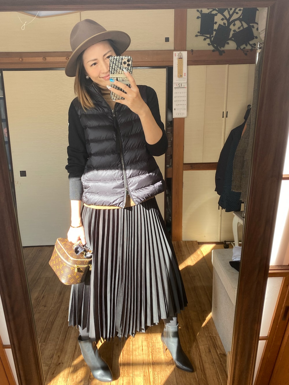 「UNIQLOのアイテム（スカート、ブラック系）」を使った、yoyoさん（レディース・168cm）の冬コーディネートの1枚目の写真