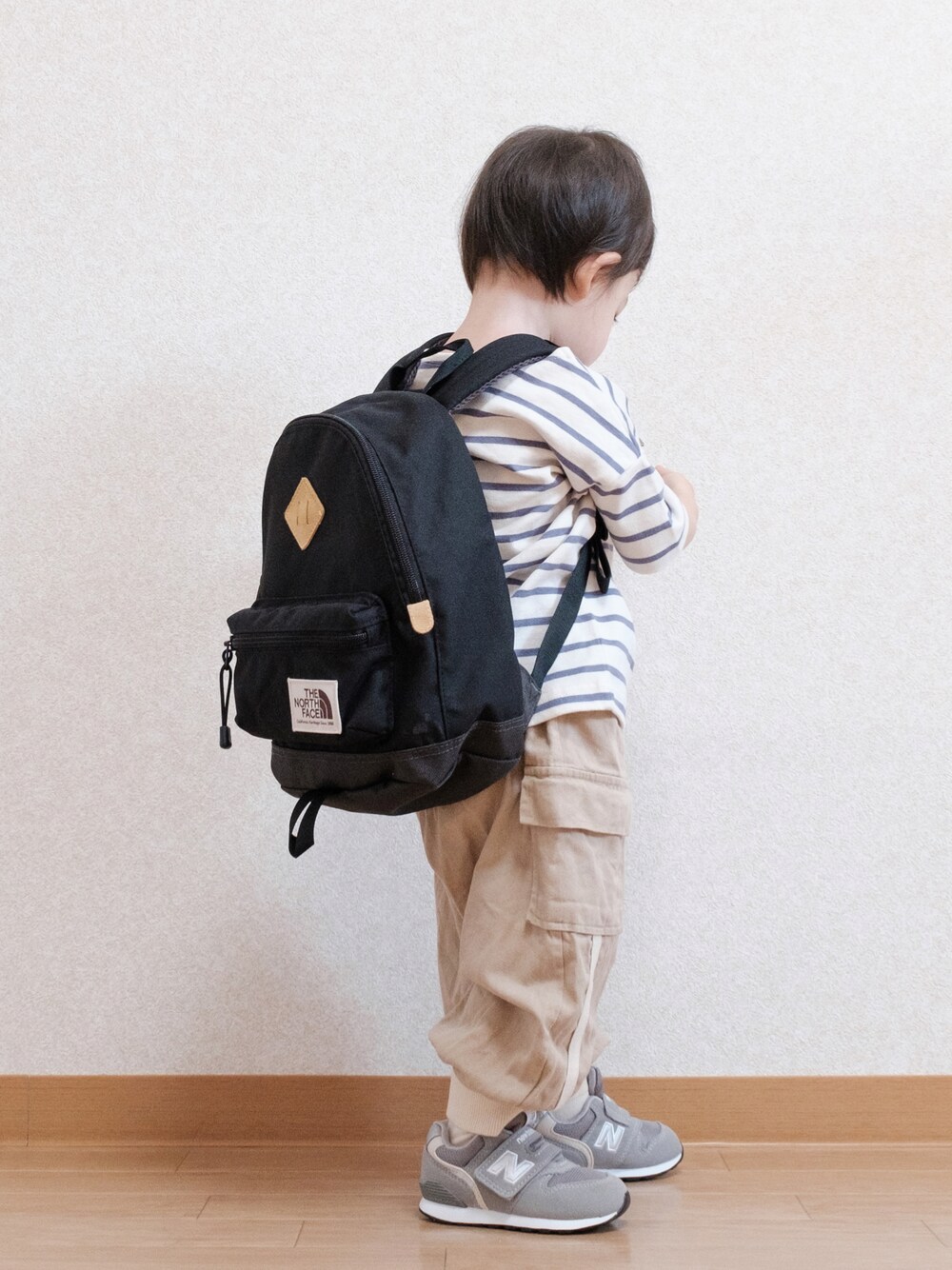 「お出かけコーデ日記、キッズファッション、カジュアル、初夏コーデ、男の子コーデ、ボーダー、ボーダートップス、リュック、バックパック、ノースフェイス、カーゴパンツ、New Balance、ニューバランス、お出かけコーデ、1歳7ヶ月」｜「THE NORTH FACEのTHE NORTH FACE/ザ・ノース・フェイス/K BERKELEY/キッズ バークレイ/KIDS/ｷｯｽﾞ/NMJ71751/K BERKELEY（バックパック/リュック、ブラック系）」を使った、ITSUKIさん（キッズ・80cm）の春コーディネートの1枚目の写真