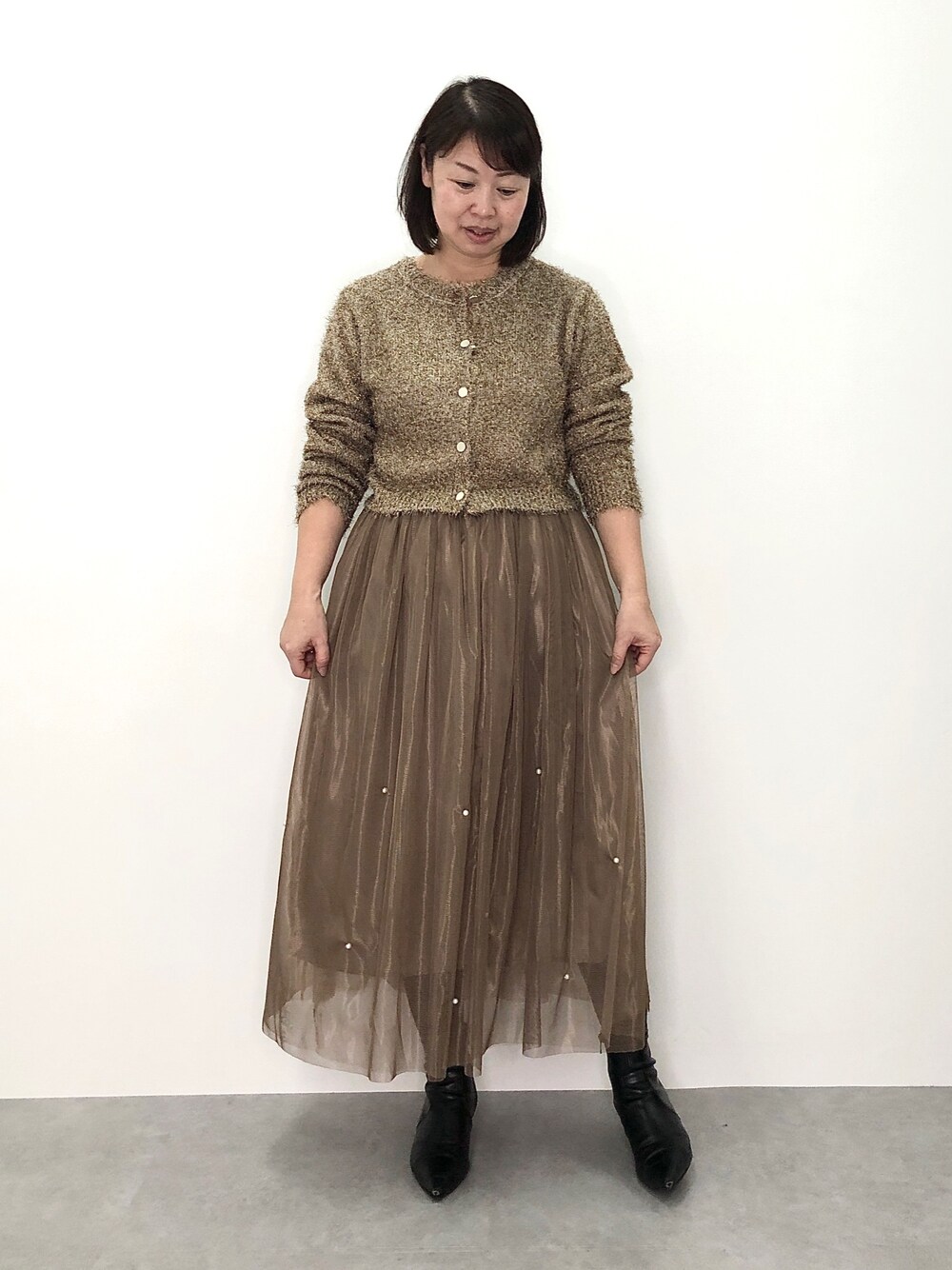 nissen（ニッセン）の「ゴールド調ボタンラメシャギーニット