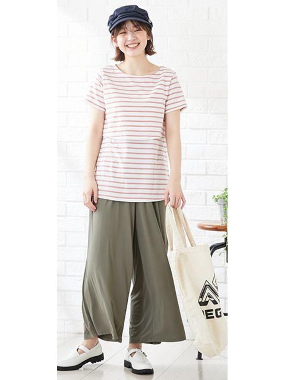 グリーン系のマタニティウェア/グッズ、ピンク系のマタニティウェア/グッズを着用したレディースの春コーディネートの1枚目の写真