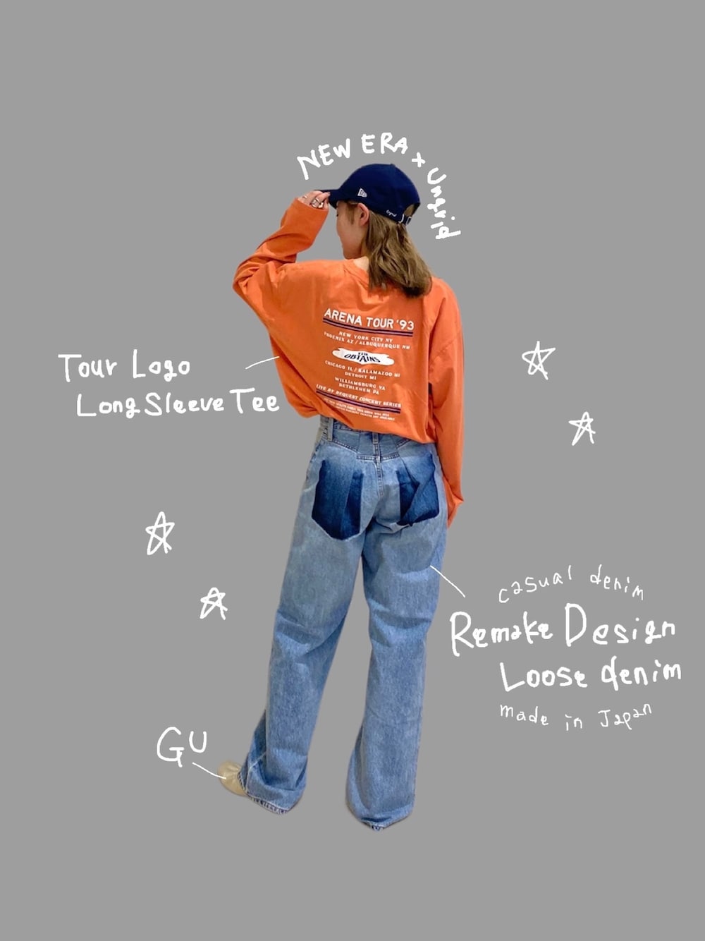 オレンジ系のTシャツ/カットソー、ブルー系のデニムパンツを着用したレディースの冬コーディネートの1枚目の写真