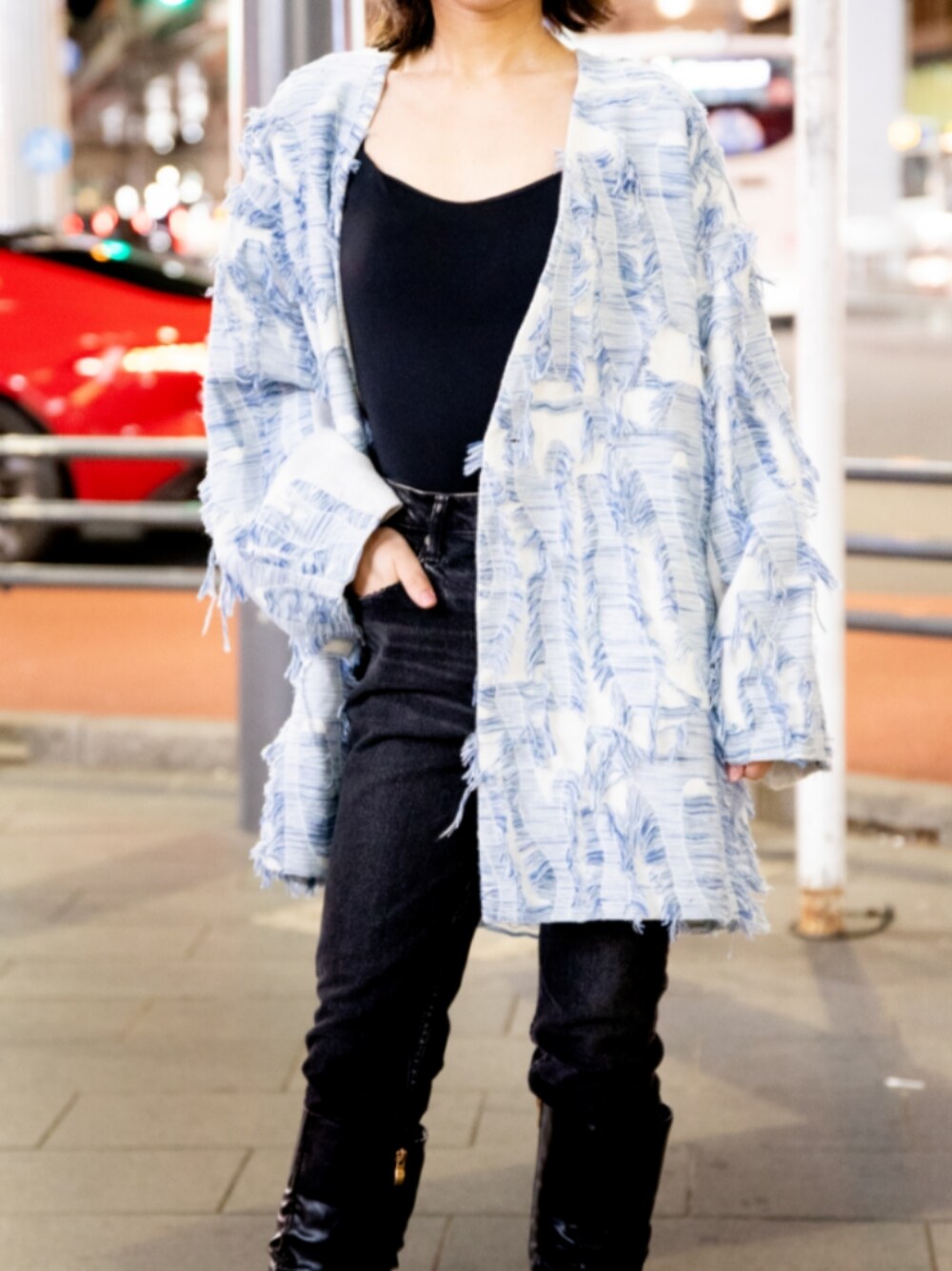 オレンジ系のその他を着用したレディースの春コーディネートの1枚目の写真