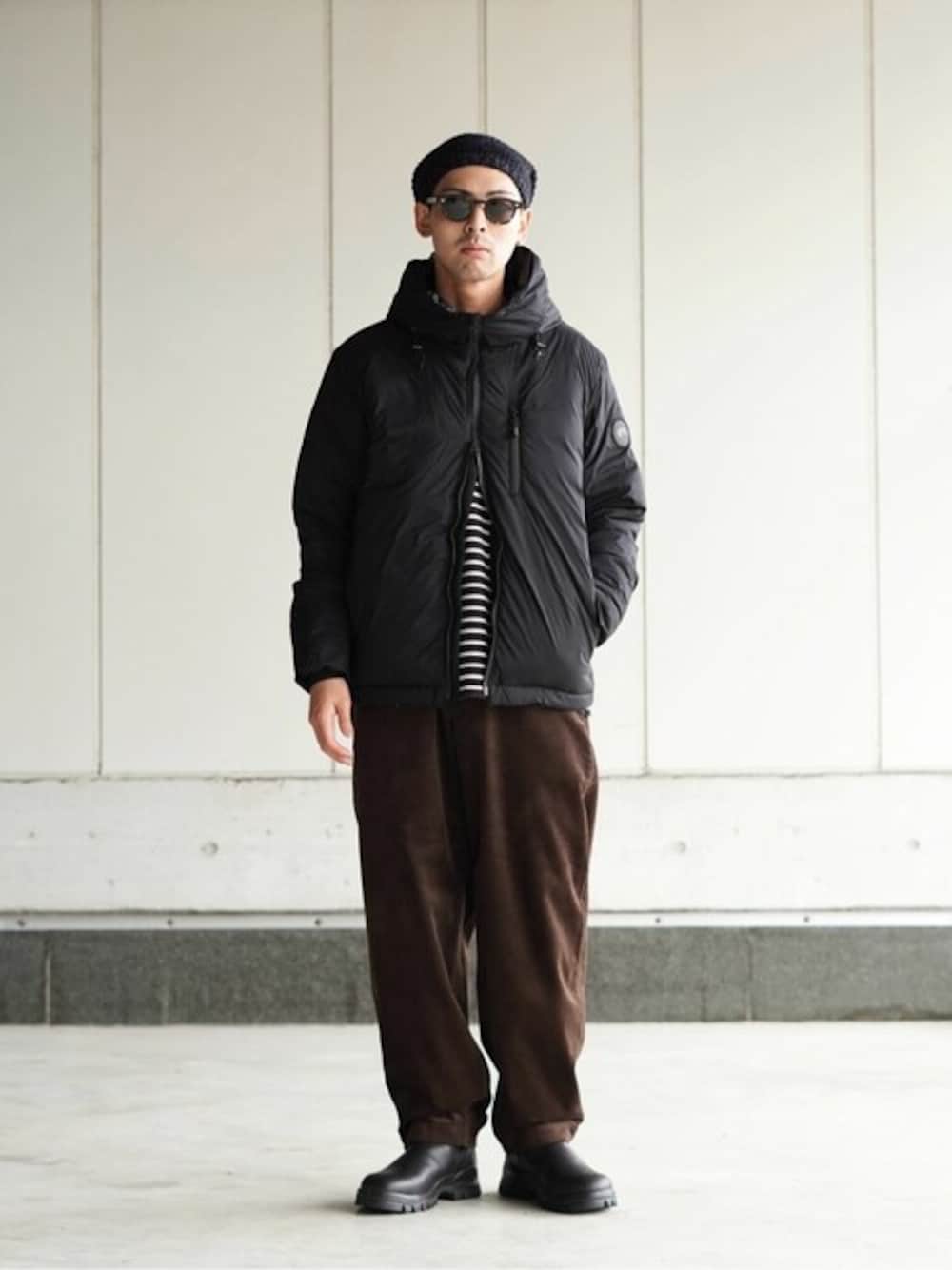 「ダウンジャケット、THE NORTH FACE PURPLE LABEL、CANADA GOOSE、ニットビーニー、blundstone、JULIUS TART OPTICAL、BALLAST ARK」｜「BALLAST ARKのBALLAST ARK / バラストアーク：BEANIE：BA08-C001[AST]（ニットキャップ/ビーニー、ブラック系）」を使った、ARKnets STAFFさん（メンズ・169cm）の秋コーディネートの1枚目の写真