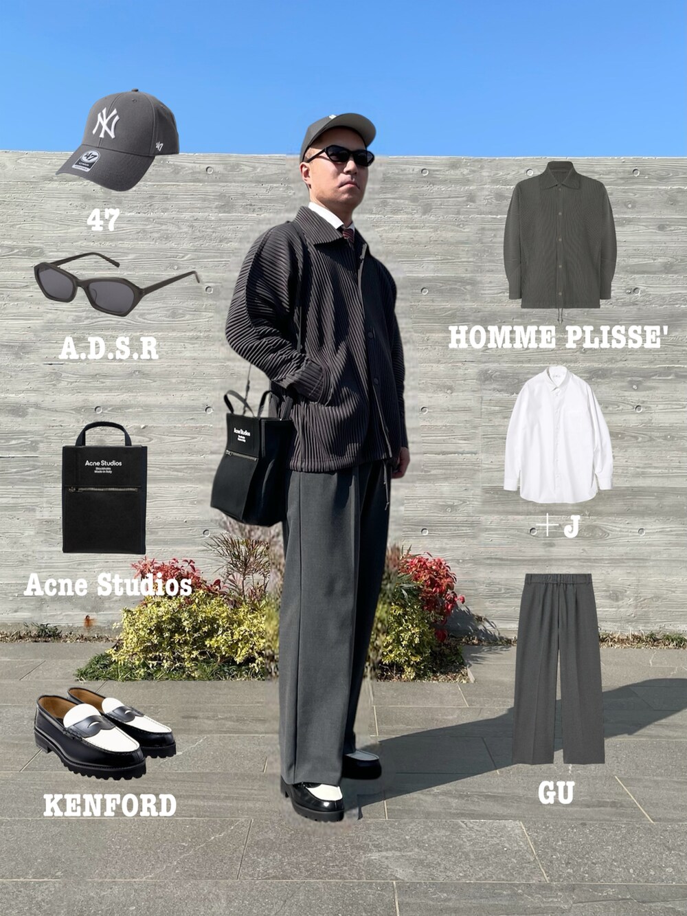 グレー系のブルゾン、ブラック系のトートバッグ、グレー系のスラックスを着用したメンズの春コーディネートの2枚目の写真