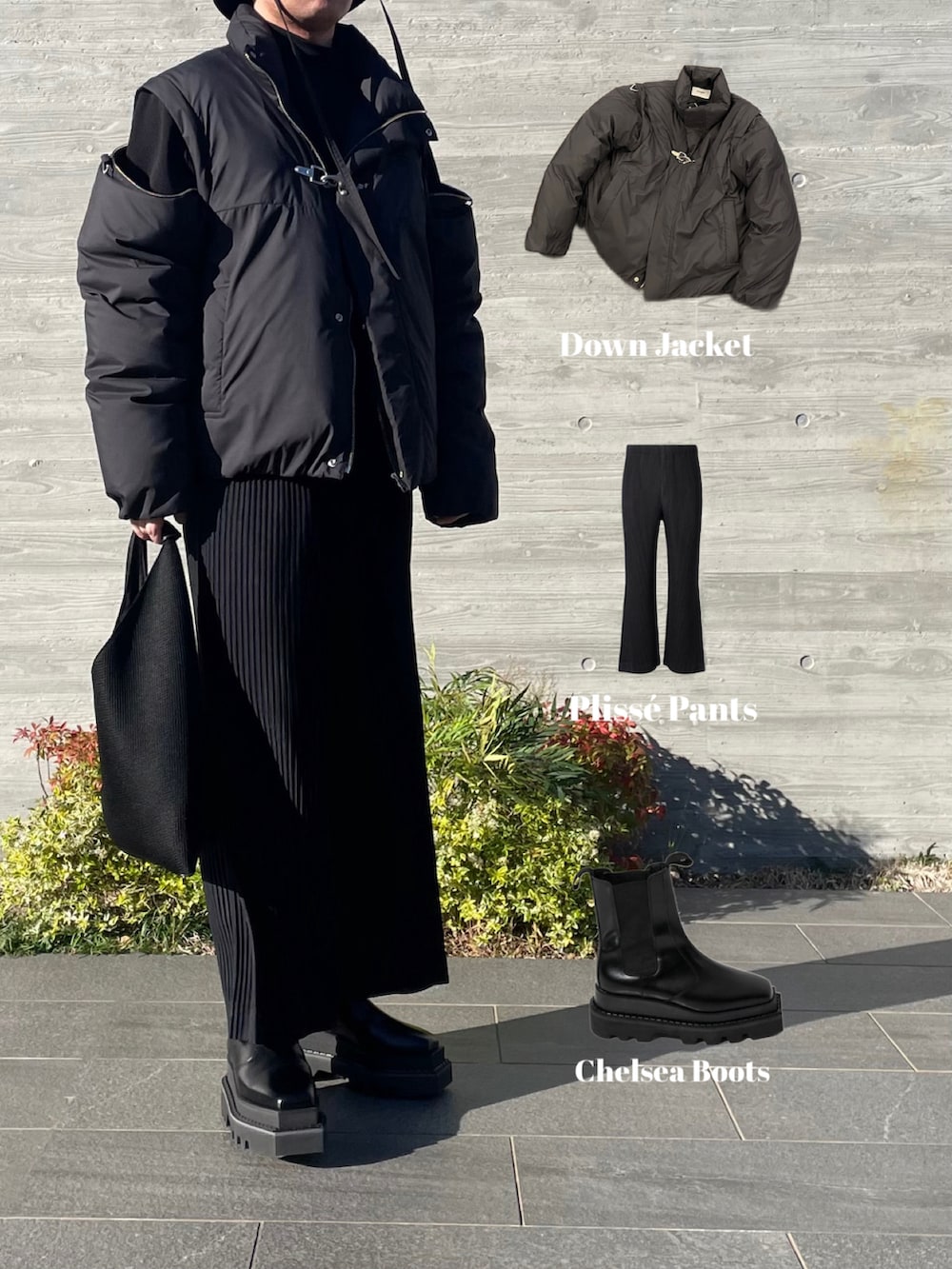 ブラック系のその他アウター、ブラック系のトートバッグ、ブラック系のその他パンツを着用したメンズの秋コーディネートの5枚目の写真