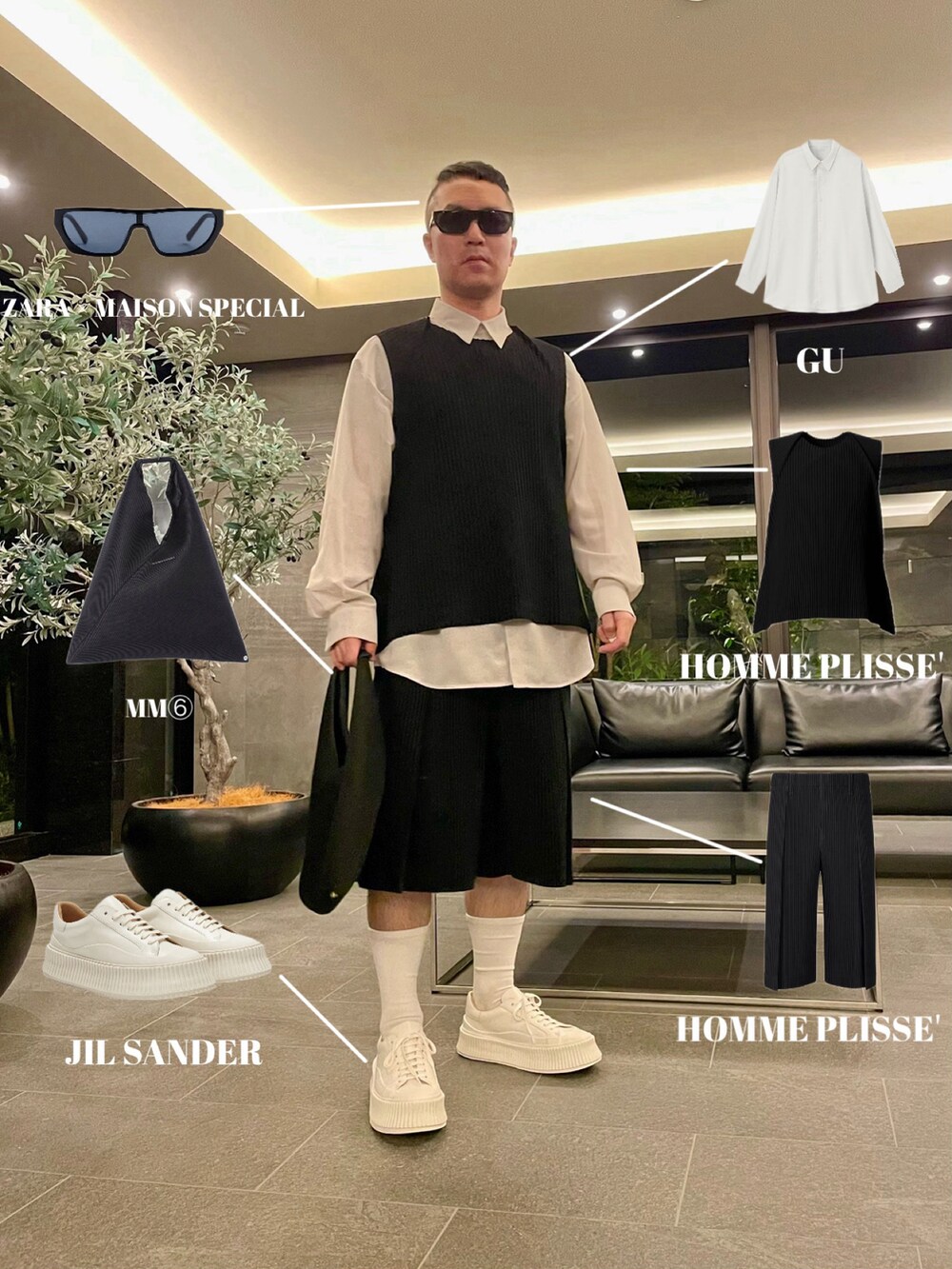 ブラック系のベスト、ブラック系のその他パンツ、ホワイト系のスニーカーを着用したメンズの春コーディネートの4枚目の写真