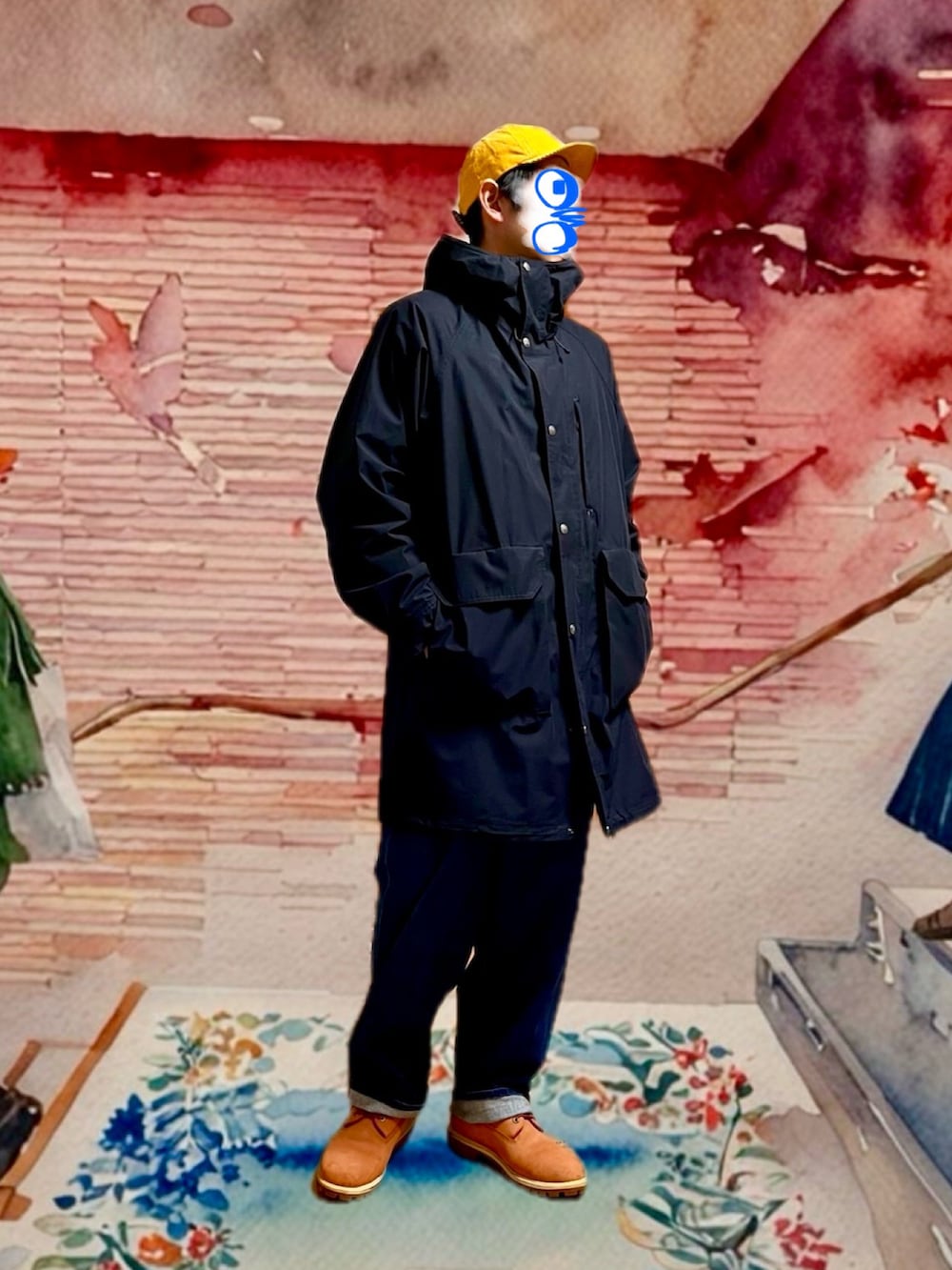 ブラック系のその他アウター、ブルー系のデニムパンツ、その他のニット/セーターを着用したメンズの冬コーディネートの2枚目の写真