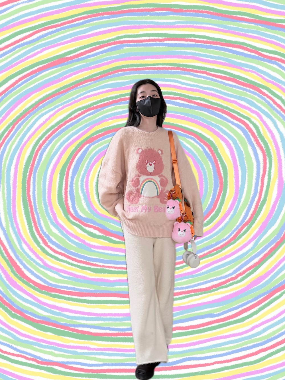 ピンク系のニット/セーター、ブラック系のノーカラージャケット、ベージュ系のパンツを着用したレディースの冬コーディネートの4枚目の写真