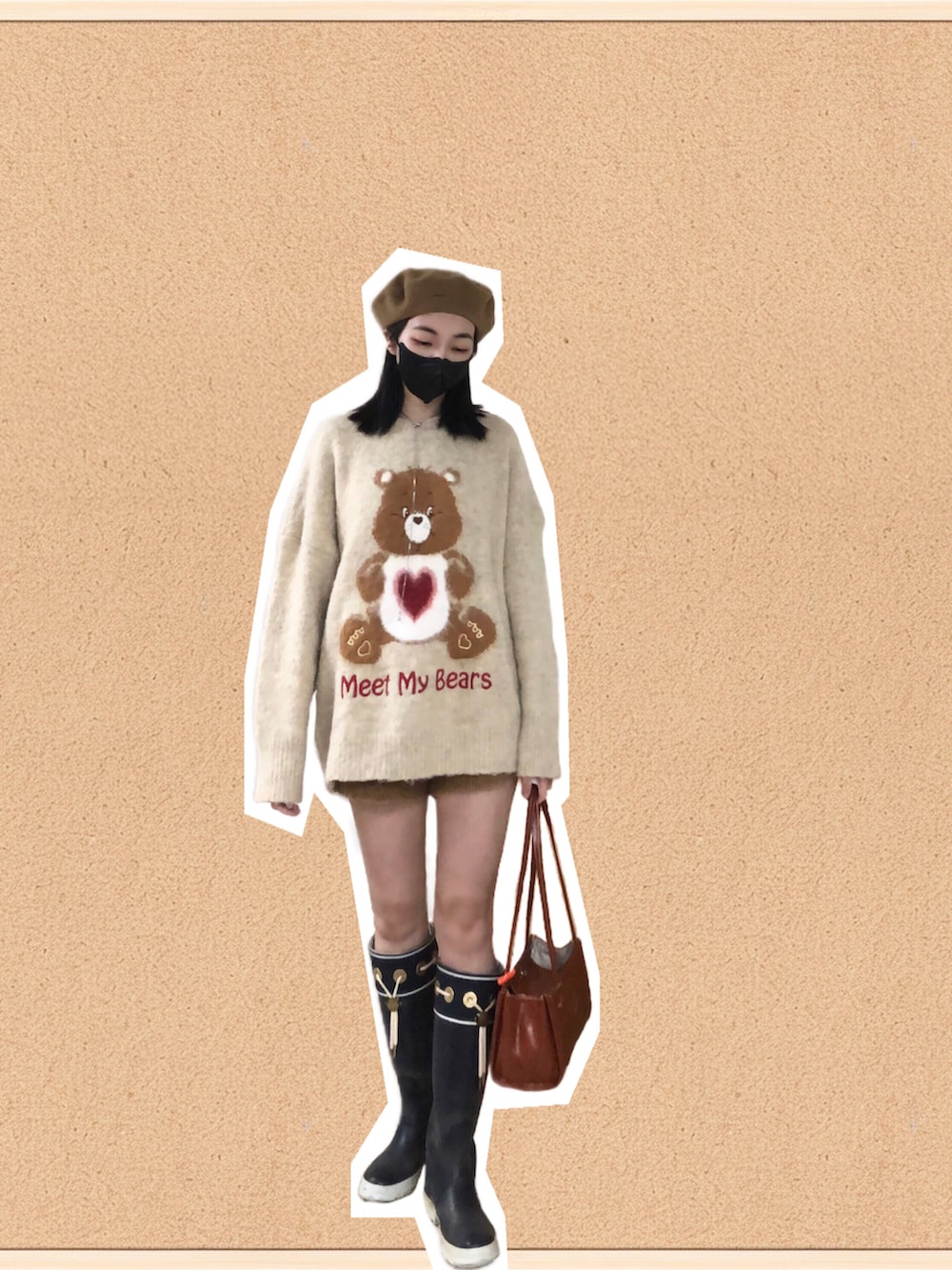 イエロー系のニット/セーター、ブラウン系のカーゴパンツ、ブラック系のスーツジャケットを着用したレディースの春コーディネートの2枚目の写真