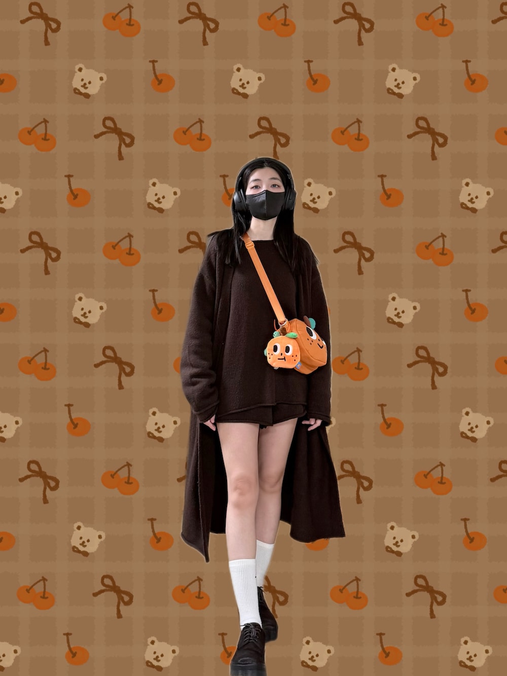 ブラウン系のニット/セーター、ブラウン系のピーコート、ブラウン系のその他パンツを着用したレディースの冬コーディネートの3枚目の写真