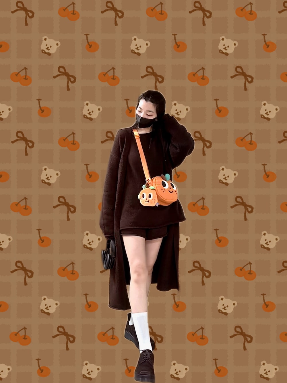 ブラウン系のニット/セーター、ブラウン系のピーコート、ブラウン系のその他パンツを着用したレディースの冬コーディネートの4枚目の写真