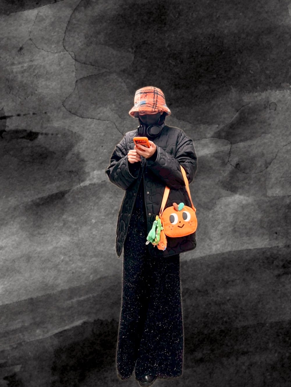 ブラック系のニット/セーター、ブラック系のノーカラージャケット、ブラック系のスカートを着用したレディースの冬コーディネートの2枚目の写真