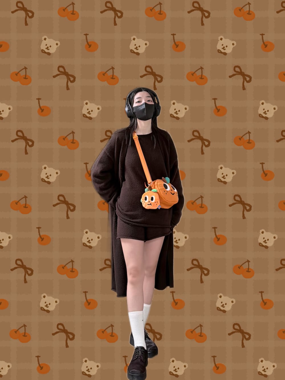 ブラウン系のニット/セーター、ブラウン系のピーコート、ブラウン系のその他パンツを着用したレディースの冬コーディネートの2枚目の写真