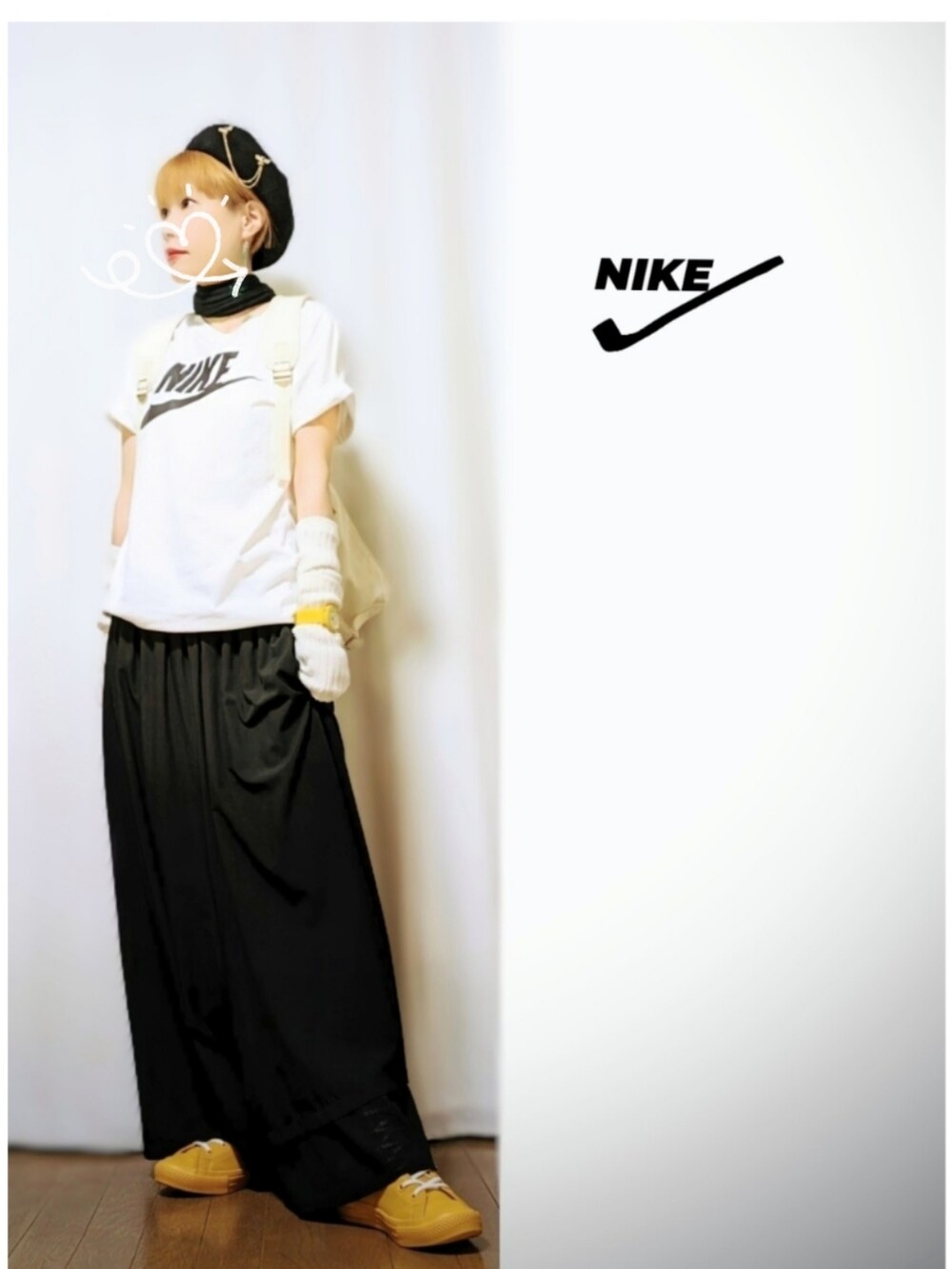 ブラック系のテーラードジャケット、ブラック系のパンツ、ホワイト系のバックパック/リュックを着用したレディースの春コーディネートの2枚目の写真