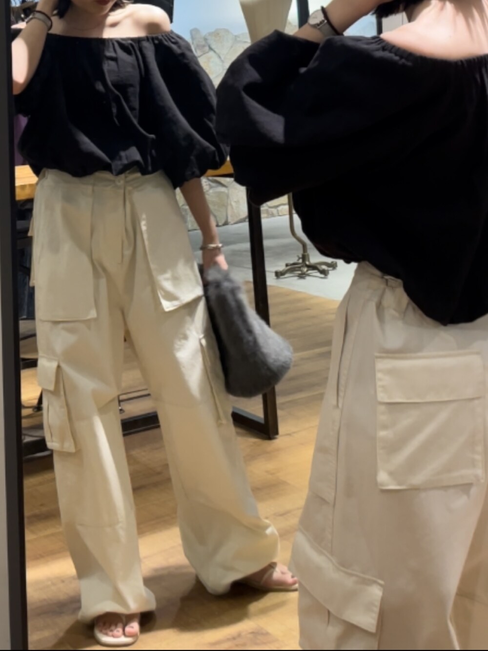 ホワイト系のサンダル、グレー系のハンドバッグ、ブラック系のシャツ/ブラウスを着用したレディースの夏コーディネートの4枚目の写真