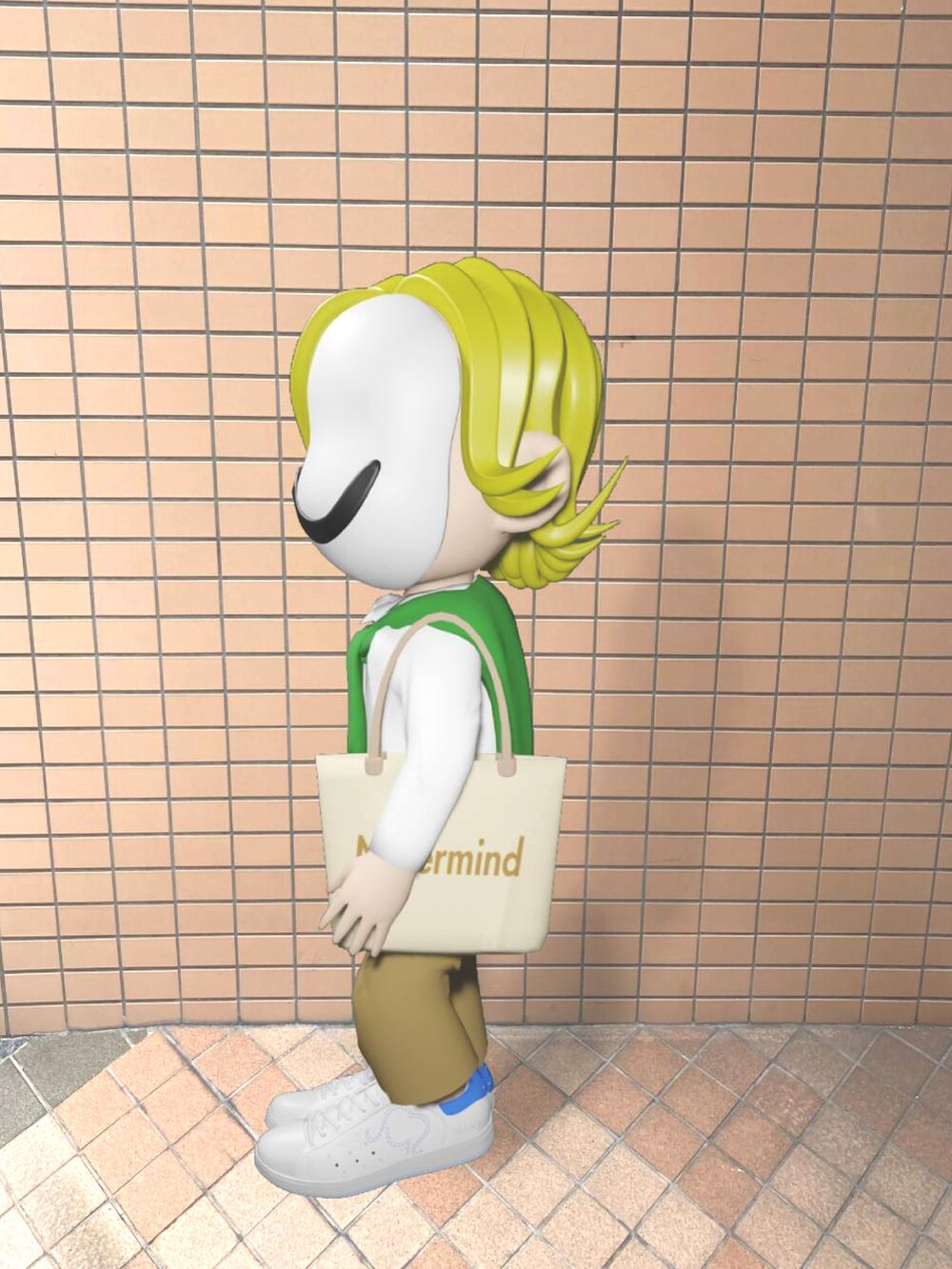 ベージュ系のトートバッグ、ホワイト系のスニーカー、グリーン系のカーディガン/ボレロを着用したメンズの春コーディネートの2枚目の写真