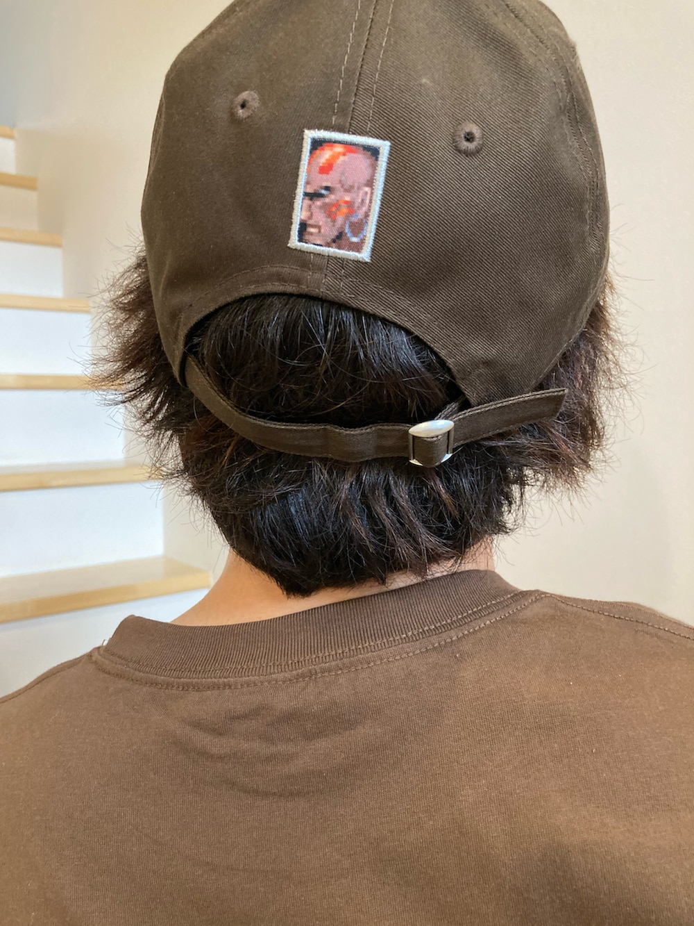 「古着MIX、アツいコーデ全部見せ、夏コーデ、ショートパンツ、ブラウン、ストリートファイター、NEW ERA」｜「HUFのREGIONAL S/SL TEE / HUF ハフ Tシャツ（Tシャツ/カットソー、ホワイト系）」を使った、垂金権造さん（メンズ・171cm）の夏コーディネートの2枚目の写真