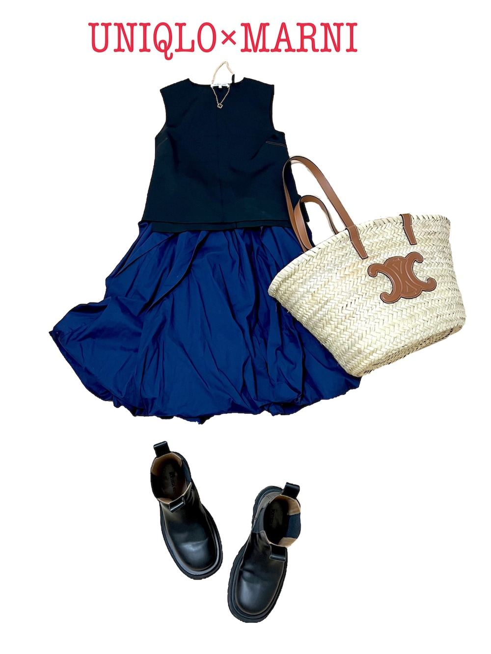 ブラック系のタンクトップ、ブルー系のスカート、ベージュ系のかごバッグを着用したレディースの夏コーディネートの3枚目の写真