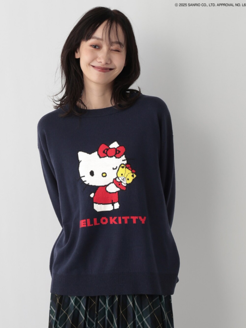 ブルー系のニット/セーターを着用したレディースの冬コーディネートの2枚目の写真