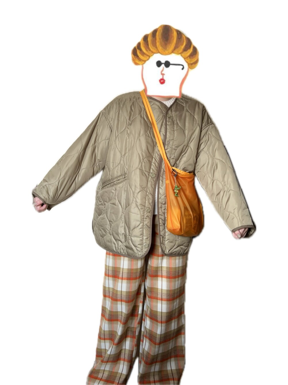 ホワイト系のニット/セーター、ホワイト系のその他パンツ、グリーン系のノーカラージャケットを着用したレディースの冬コーディネートの2枚目の写真