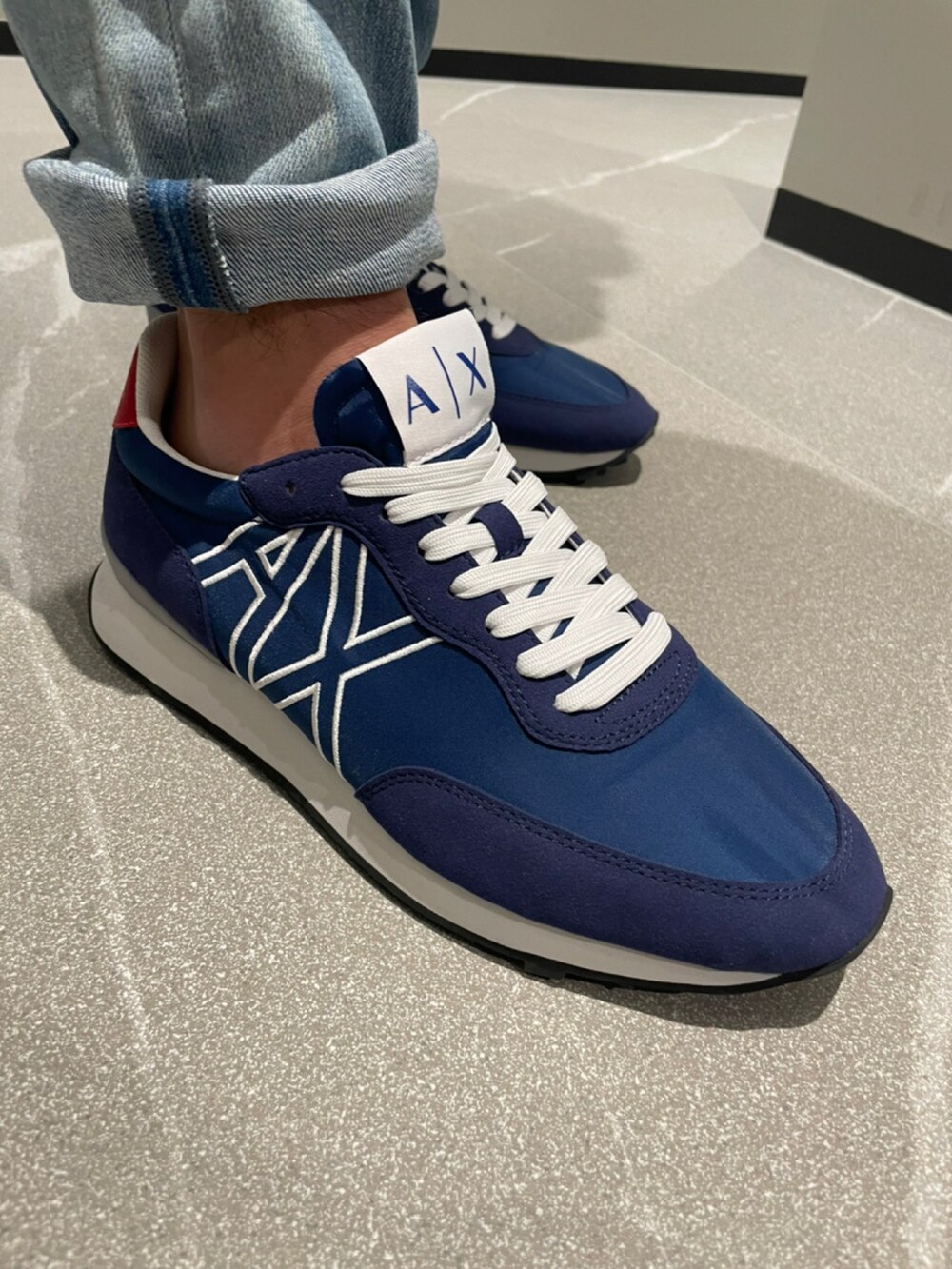 「アルマーニエクスチェンジ、armaniexchange、AXchange、AXchanger、低身長コーデ、メガネ男子、春夏コーデ、ブルー x ホワイト、ナイロンブルゾン、白Tシャツ、パーカー、デニム、オーバーサイズ、スポーツミックス、ラフコーデ」｜「ARMANI EXCHANGEの【A|X アルマーニ エクスチェンジ】カラーブロックデザイン　ジップアップ　フーディナイロンジャケット（リサイクルナイロン）（ブルゾン、ブルー系）」を使った、ゆーきさん（メンズ・169cm）の春コーディネートの3枚目の写真