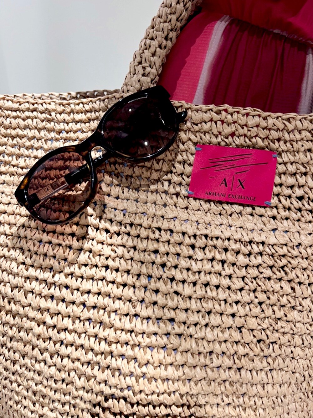 「armaniexchange、オールインワン、レッド、夏コーデ、summer、きれいめカジュアル、AXchanger、オトナカジュアル、ラクチンコーデ、休日コーデ、サンダル、AXchange、アルマーニエクスチェンジ、春夏コーデ」｜「ARMANI EXCHANGEの【A|X アルマーニ エクスチェンジ】フローラルプリントストローバッグ（トートバッグ、ベージュ系）」を使った、Queen♡さん（レディース・167cm）の春コーディネートの2枚目の写真