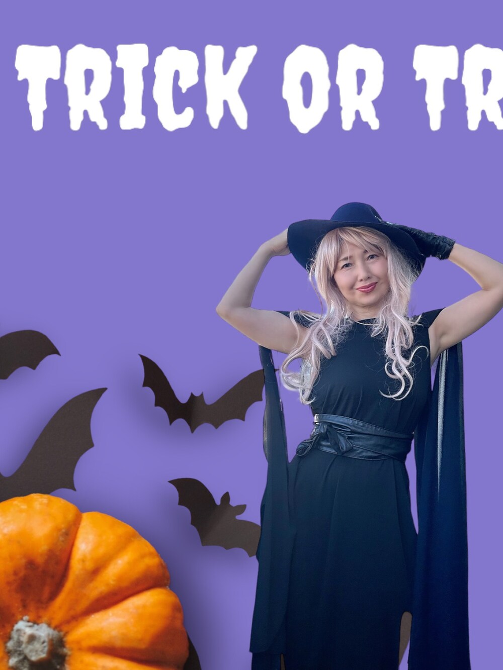 ブラック系のワンピース/ドレス、ブラック系のブーツ、ブルー系のハットを着用したレディースの秋コーディネートの4枚目の写真