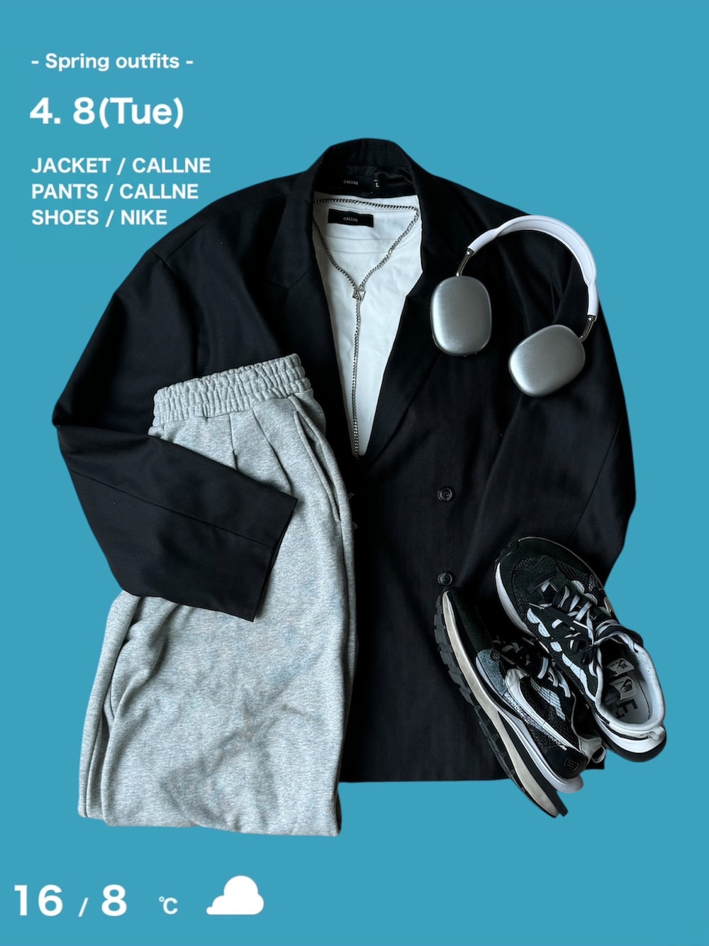 グレー系のテーラードジャケット、ブルー系のデニムパンツ、ブラック系のローファーを着用したメンズの春コーディネートの3枚目の写真