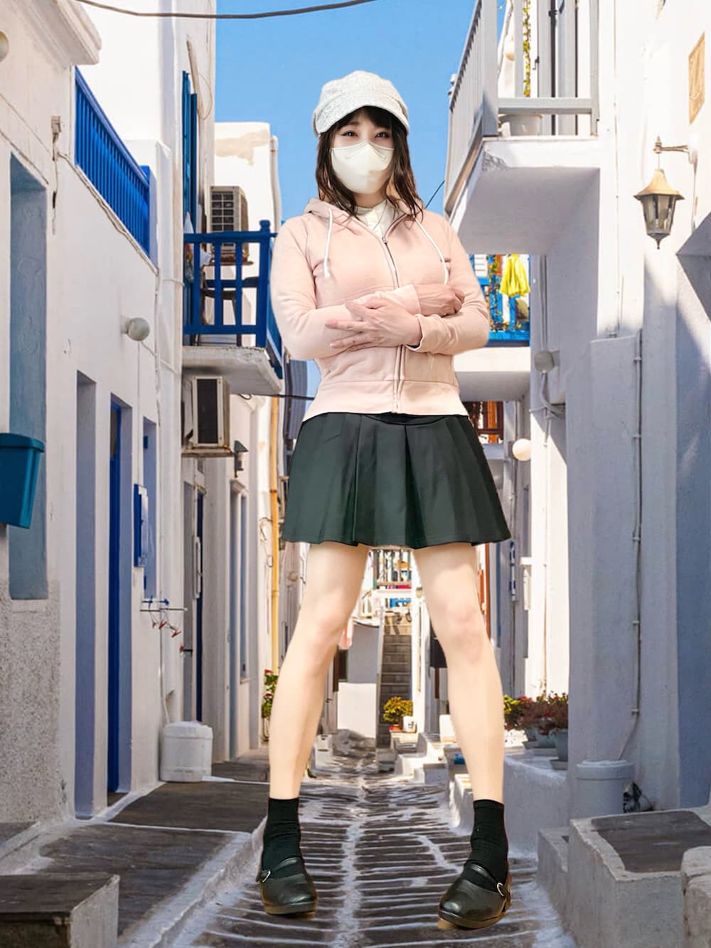 ピンク系のパーカー、ブラック系のスカート、ブラック系のバレエシューズを着用したレディースの春コーディネートの2枚目の写真