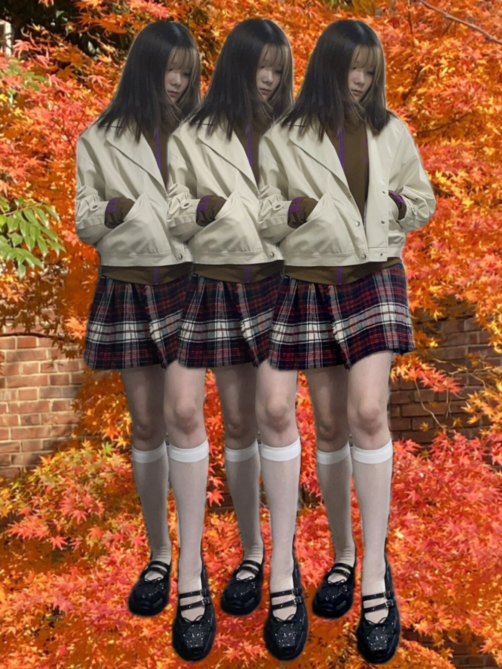 ブラック系のブルゾン、レッド系のスカート、ブラック系のローファーを着用したレディースの冬コーディネートの2枚目の写真