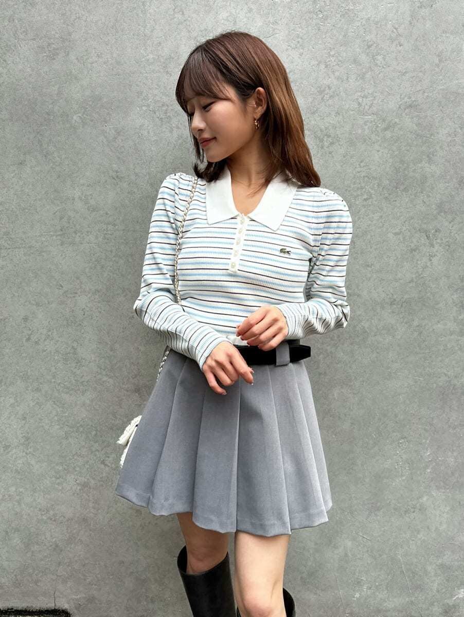 ピンク系のダウンジャケット/コート、その他のニット/セーター、グレー系のその他パンツを着用したレディースの秋コーディネートの9枚目の写真