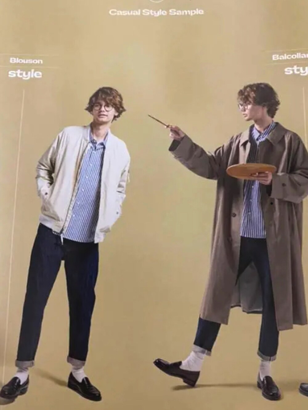 ブルー系のデニムジャケット、ブラック系のニット/セーター、グレー系のスラックスを着用したメンズの春コーディネートの4枚目の写真