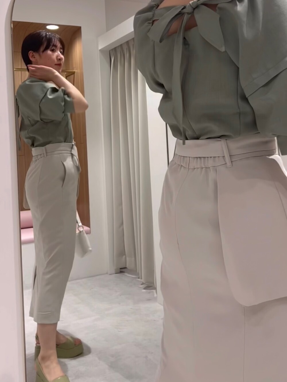 ホワイト系のハンドバッグ、ベージュ系のサンダル、グリーン系のシャツ/ブラウスを着用したレディースの春コーディネートの2枚目の写真