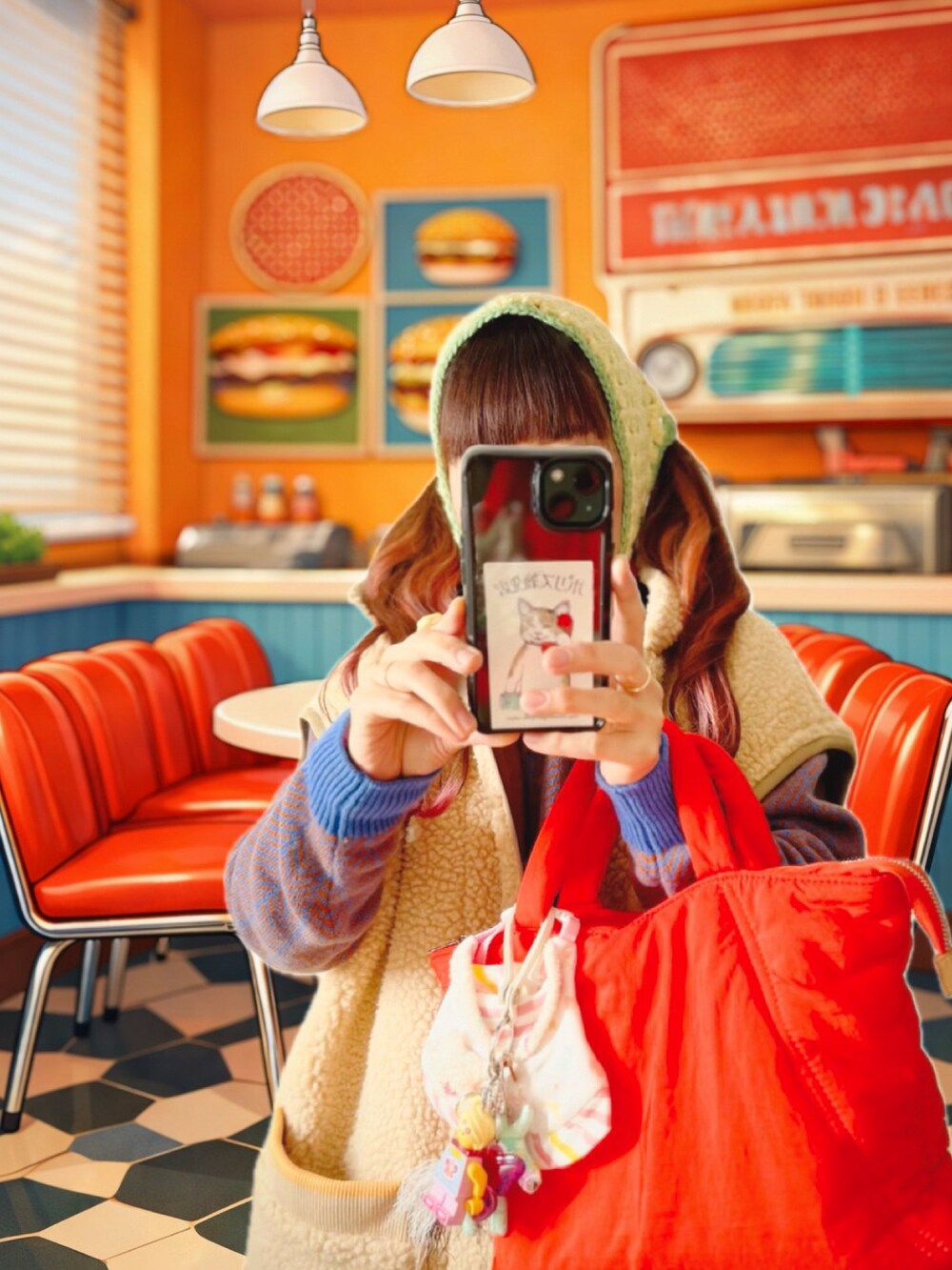 ピンク系のスニーカー、ベージュ系のその他アウター、ブルー系のニット/セーターを着用したレディースの冬コーディネートの5枚目の写真