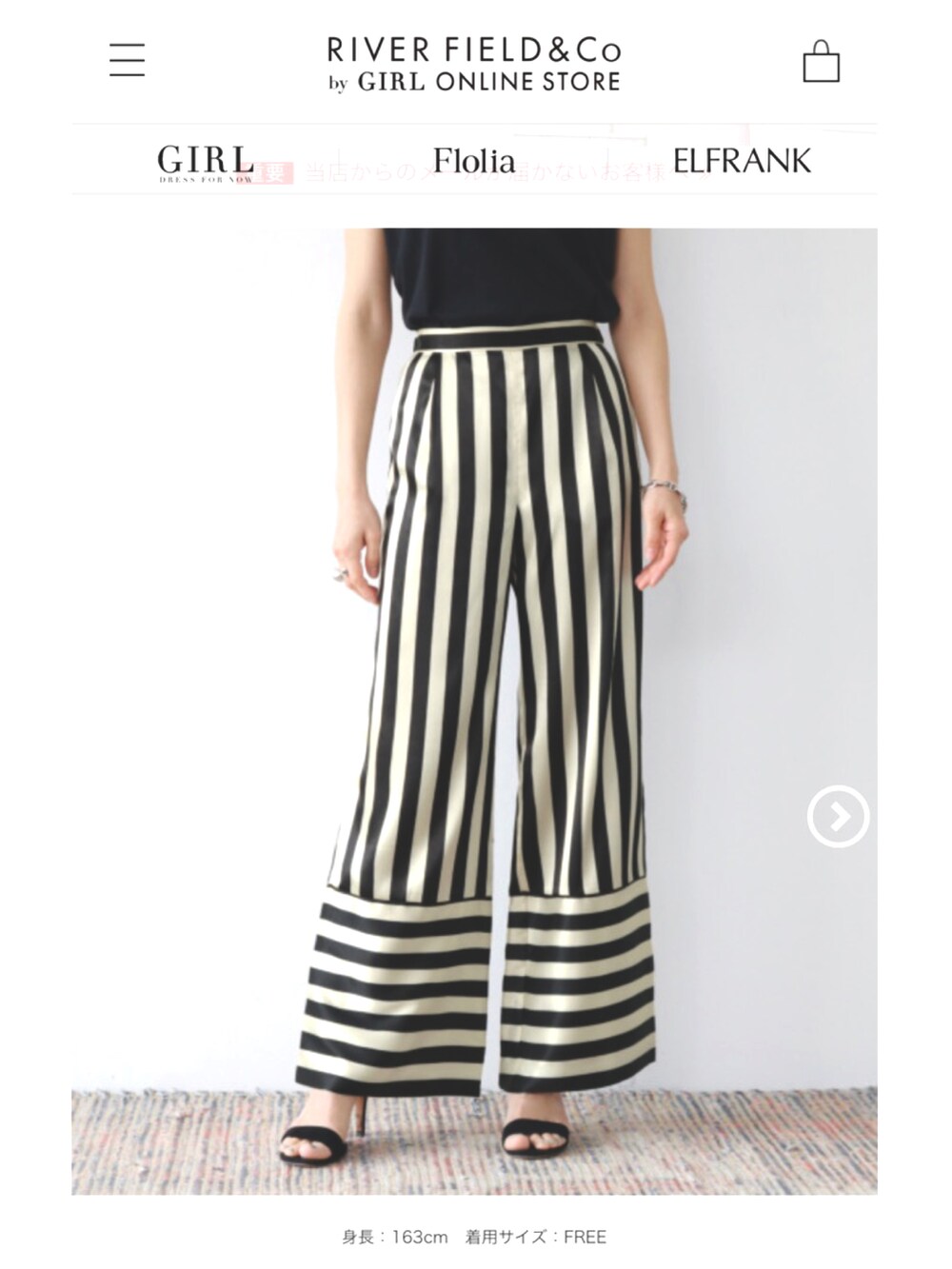 ブラック系のその他パンツ、ブラック系のブーツ、シルバー系のアナログ腕時計を着用したレディースの秋コーディネートの3枚目の写真