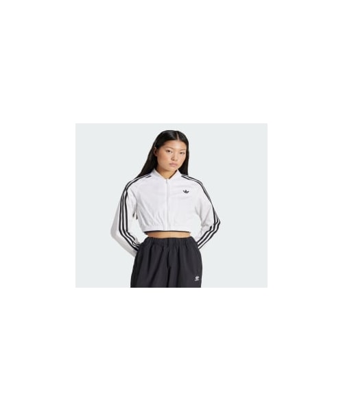 adidas クロップド トラックトップ adidas（アディダス）の「アディカラー デニムクロップド トラック