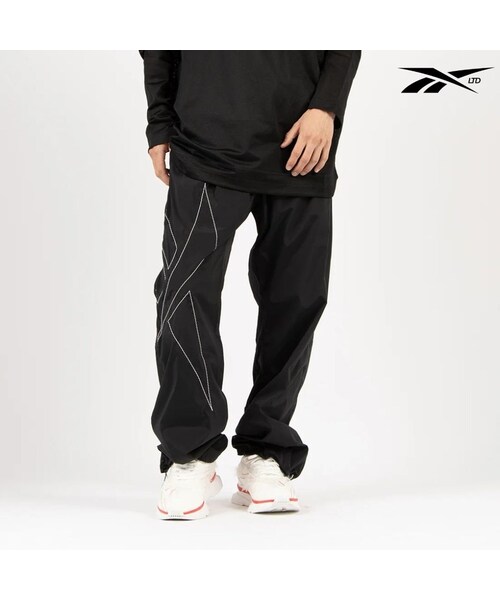 Reebok（リーボック）の「KANGHYUK ロゴ トラックパンツ / STITCHED