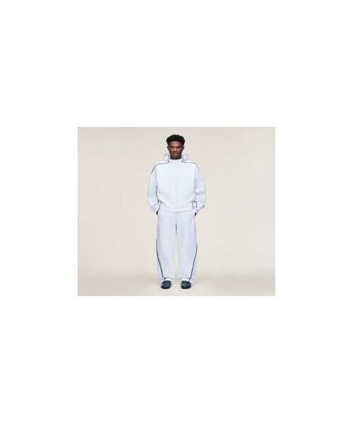 adidas(アディダス)の「adidas x Arte Antwerp Z.N.E. トラックパンツ(ジャージ)(パンツ・メンズ・ホワイト/レッド/ブルー・2XS/XS/S/M/L/XL/2XL/3XL/4XL/5XL/6XL)」の1枚目の写真