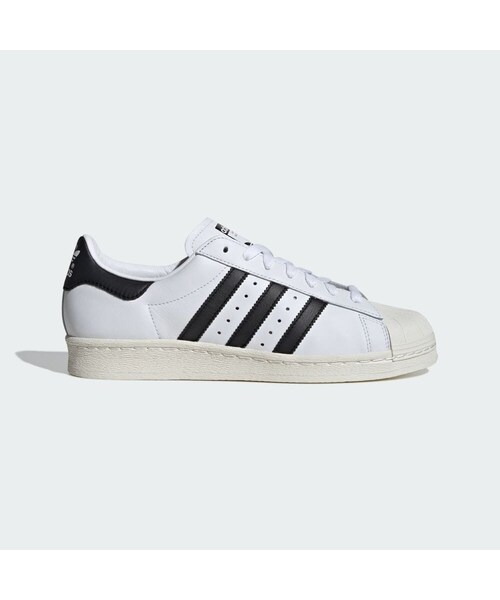 adidas(アディダス)の「スーパースター 82 / Superstar 82(シューズ・メンズ・ブラック/ホワイト・22.0cm/22.5cm/23.0cm/23.5cm/24.0cm/24.5cm/25.0cm/25.5cm/26.5cm/27.5cm/28.0cm/29.0cm/29.5cm/30.0cm/26.0cm/27.0cm/28.5cm/31.0cm/30.5cm/31.5cm/32.0cm)」の1枚目の写真