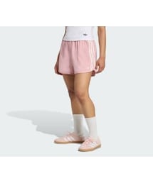 adidas（アディダス）の「adidas Originals サテン ショーツ ラッフル スリーストライプス（パンツ・ピンク系）」